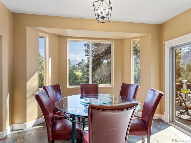 dining space featuring an inviting chandelier