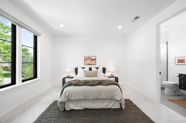 bedroom featuring carpet, baseboards, recessed lighting, and connected bathroom