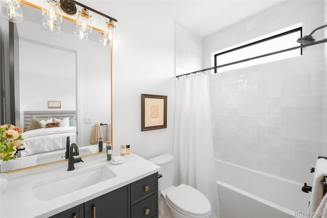 ensuite bathroom featuring toilet, shower / bath combo, and vanity