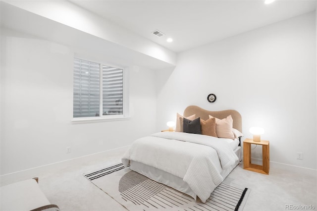 bedroom featuring light carpet, baseboards, and recessed lighting