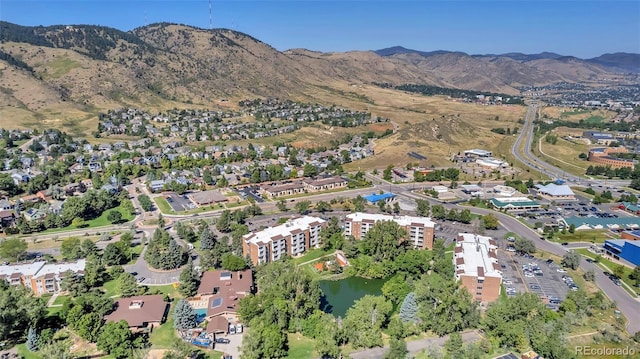 birds eye view of property featuring a mountain view