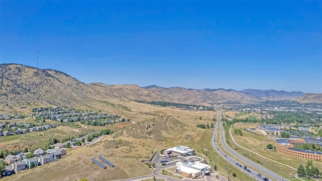 birds eye view of property featuring a mountain view