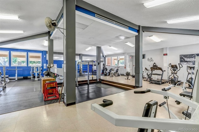 exercise room featuring a textured ceiling