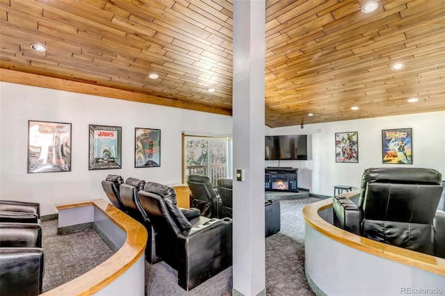 carpeted living room with lofted ceiling, wooden ceiling, recessed lighting, and a glass covered fireplace