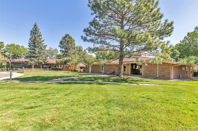 ranch-style house with a front yard