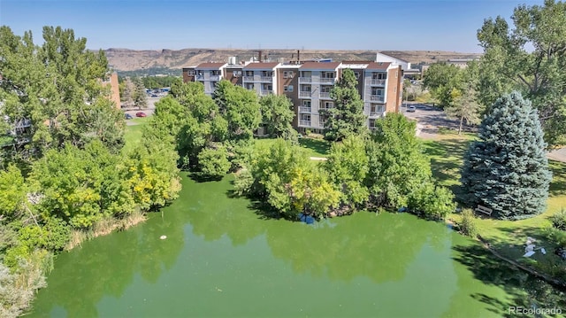 aerial view featuring a water and mountain view