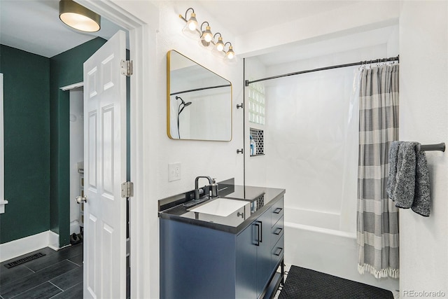 4196 S Pennsylvania St, Englewood, CO 80113 - full bathroom featuring vanity, baseboards, visible vents, and shower / tub combo