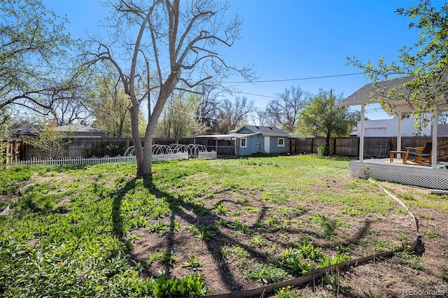 4196 S Pennsylvania St, Englewood, CO 80113 - view of yard featuring a deck, a fenced backyard, and a sunroom
