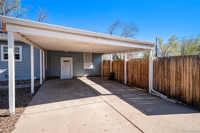 4196 S Pennsylvania St, Englewood, CO 80113 - view of vehicle parking with fence, driveway, and an attached carport