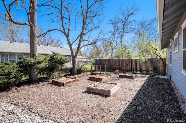 4196 S Pennsylvania St, Englewood, CO 80113 - view of yard featuring fence and a vegetable garden