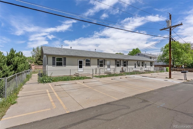 10911 W 44th Pl, Wheat Ridge, CO 80033 - view of front of home with uncovered parking and fence