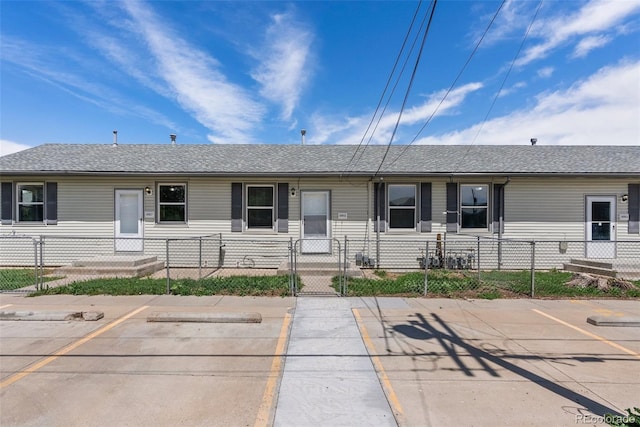 10911 W 44th Pl, Wheat Ridge, CO 80033 - view of front facade with uncovered parking, a fenced front yard, a gate, and roof with shingles
