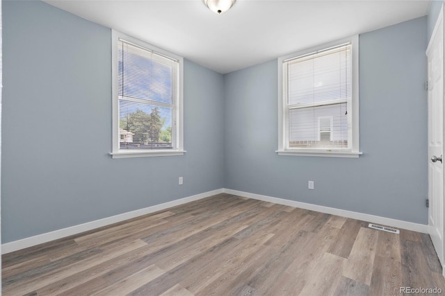 10911 W 44th Pl, Wheat Ridge, CO 80033 - empty room with wood finished floors and baseboards