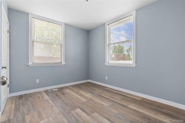 10911 W 44th Pl, Wheat Ridge, CO 80033 - empty room with wood finished floors and baseboards