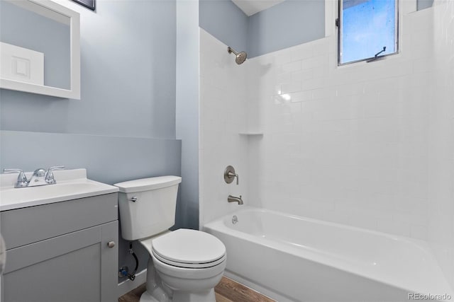 10911 W 44th Pl, Wheat Ridge, CO 80033 - full bath featuring toilet, vanity, shower / washtub combination, and wood finished floors