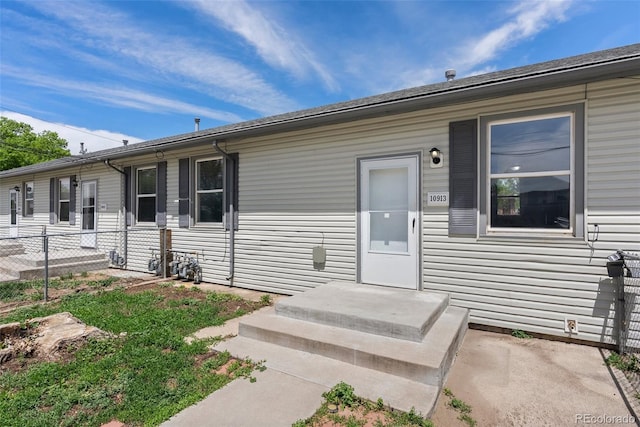 10911 W 44th Pl, Wheat Ridge, CO 80033 - property entrance featuring fence