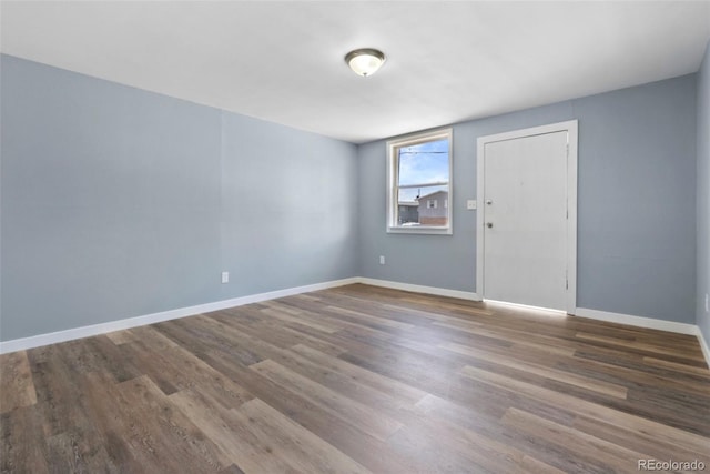 10911 W 44th Pl, Wheat Ridge, CO 80033 - unfurnished room with wood finished floors and baseboards