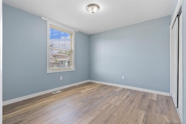 10911 W 44th Pl, Wheat Ridge, CO 80033 - spare room with light wood-style flooring and baseboards