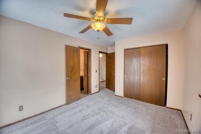 unfurnished bedroom with a ceiling fan, carpet, and a closet