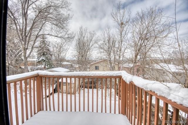 view of snow covered deck