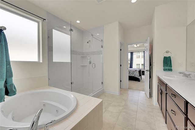 6335 E 143rd Dr, Thornton, CO 80602 - bathroom with a shower stall, a tub with jets, ensuite bath, vanity, and recessed lighting