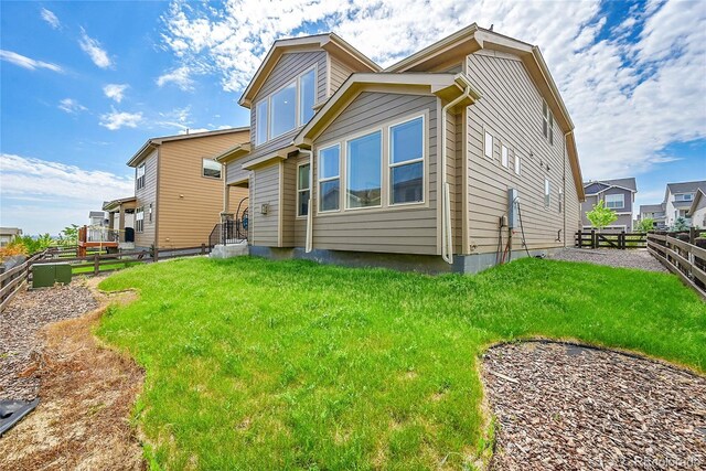 6335 E 143rd Dr, Thornton, CO 80602 - rear view of property with a fenced backyard