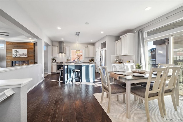 dining area featuring dark wood-type flooring