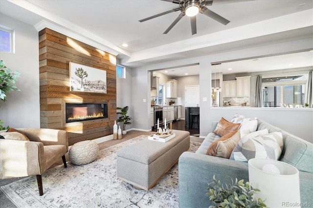 living room with plenty of natural light and ceiling fan