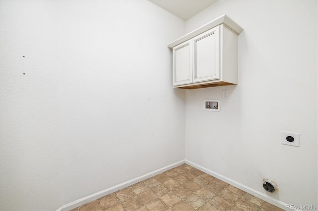 clothes washing area featuring cabinets, hookup for a washing machine, and electric dryer hookup