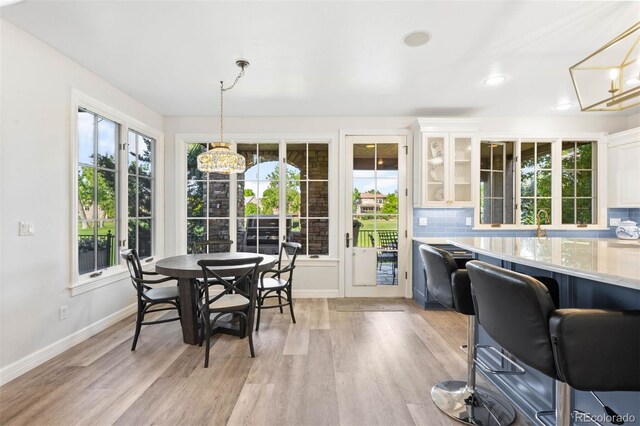 9151 E Harvard Ave, Denver, CO 80231 - dining area featuring plenty of natural light, light wood-style floors, a chandelier, and recessed lighting