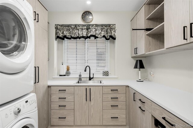 9151 E Harvard Ave, Denver, CO 80231 - washroom featuring stacked washing machine and dryer, cabinet space, and recessed lighting