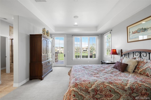9151 E Harvard Ave, Denver, CO 80231 - bedroom featuring access to outside, light colored carpet, a tray ceiling, and recessed lighting