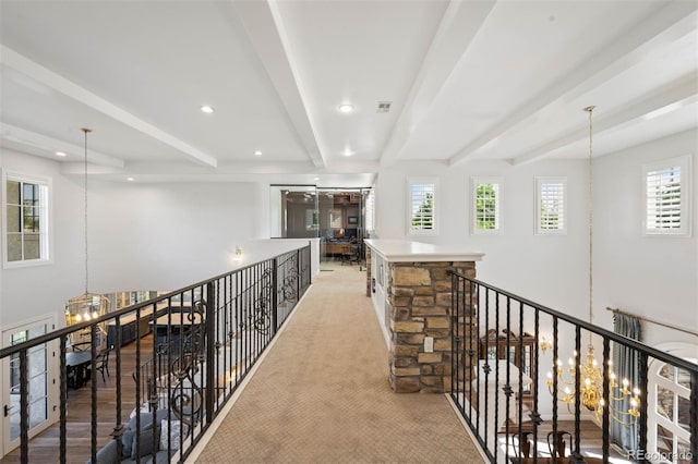 9151 E Harvard Ave, Denver, CO 80231 - hall featuring a chandelier, beam ceiling, healthy amount of natural light, an upstairs landing, and recessed lighting