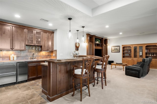 9151 E Harvard Ave, Denver, CO 80231 - bar with refrigerator, recessed lighting, backsplash, and hanging light fixtures