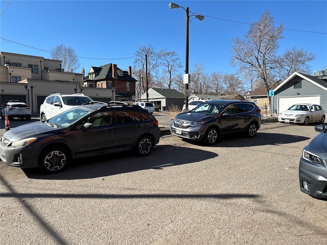 view of parking featuring a residential view