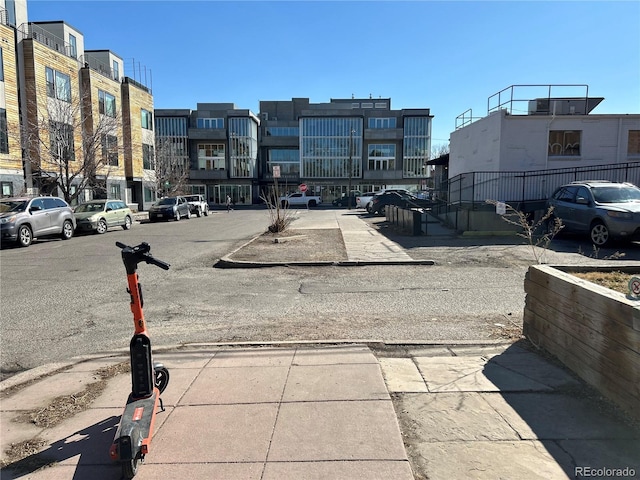 view of road with sidewalks and curbs