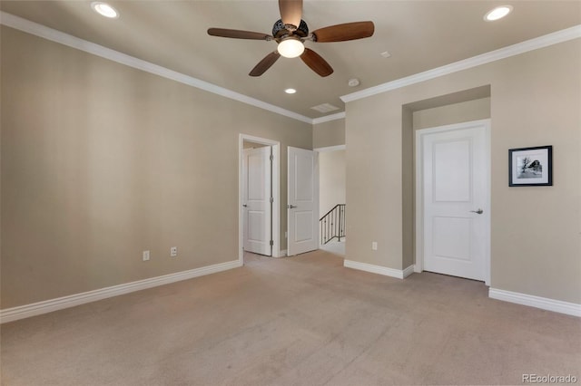 unfurnished bedroom with light carpet, ornamental molding, recessed lighting, baseboards, and ceiling fan