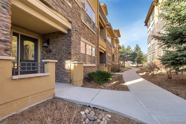 exterior space featuring stone siding