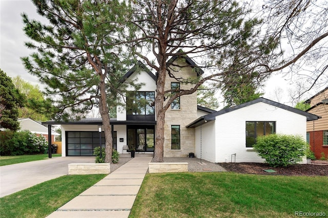 62 Jasmine St, Denver, CO 80220 - view of front of house featuring driveway, a front lawn, and an attached garage