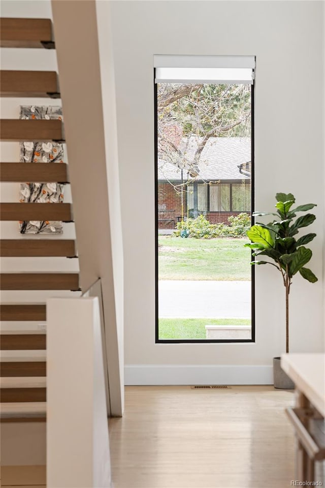 62 Jasmine St, Denver, CO 80220 - doorway with wood finished floors and baseboards