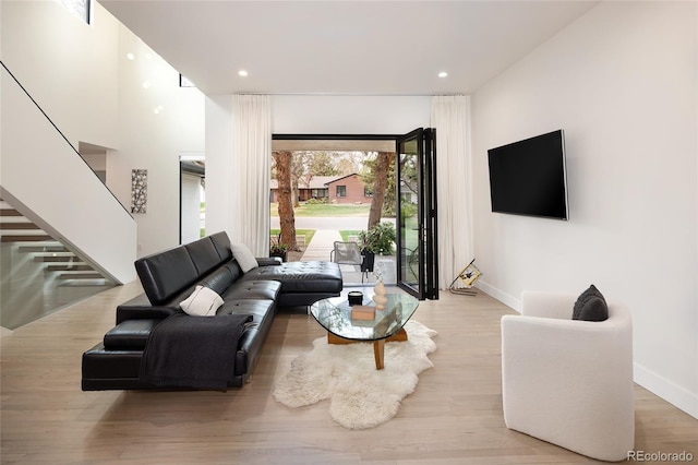 62 Jasmine St, Denver, CO 80220 - living area featuring baseboards, stairway, wood finished floors, and recessed lighting