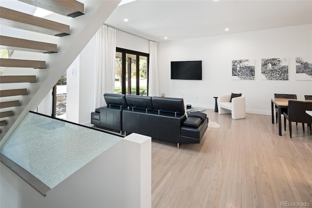 62 Jasmine St, Denver, CO 80220 - living room featuring light wood-type flooring, recessed lighting, stairway, and baseboards