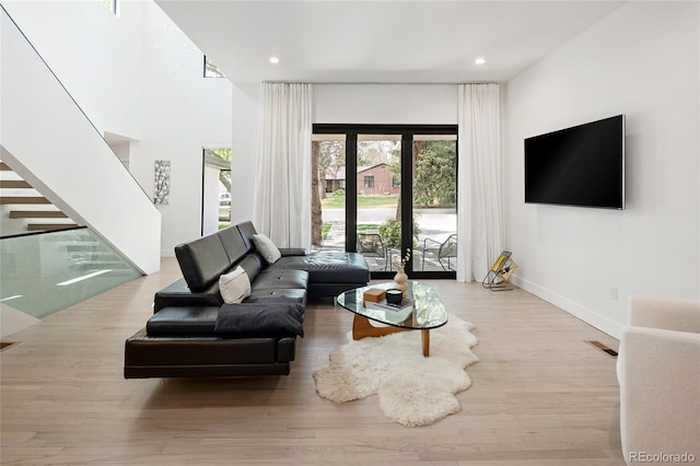 62 Jasmine St, Denver, CO 80220 - living room with stairway, wood finished floors, recessed lighting, and baseboards