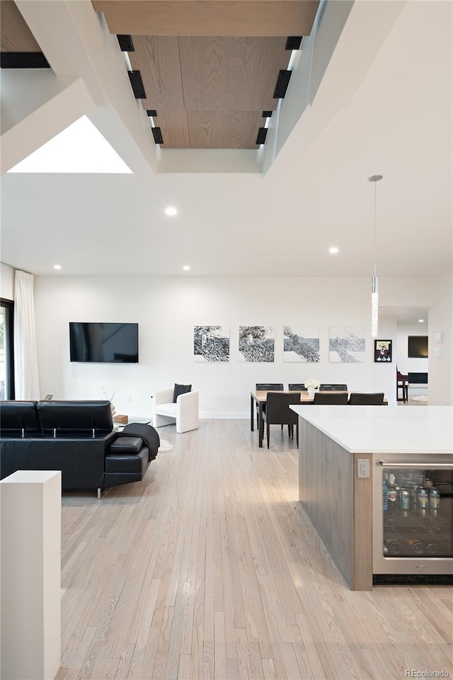 62 Jasmine St, Denver, CO 80220 - interior space featuring beverage cooler, light wood finished floors, and recessed lighting