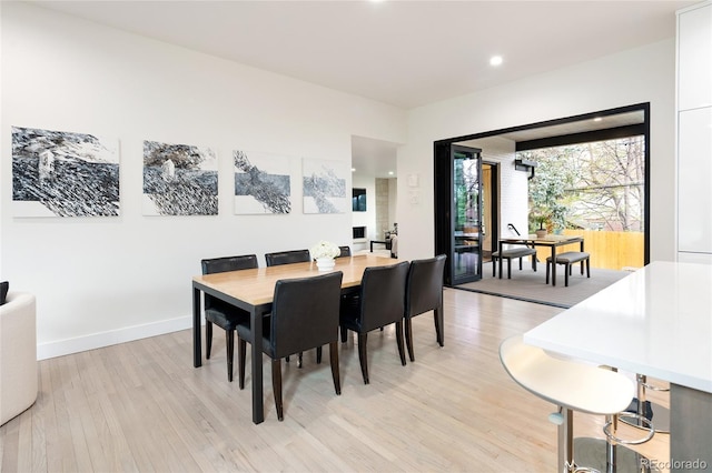 62 Jasmine St, Denver, CO 80220 - dining space with light wood-type flooring, baseboards, and recessed lighting