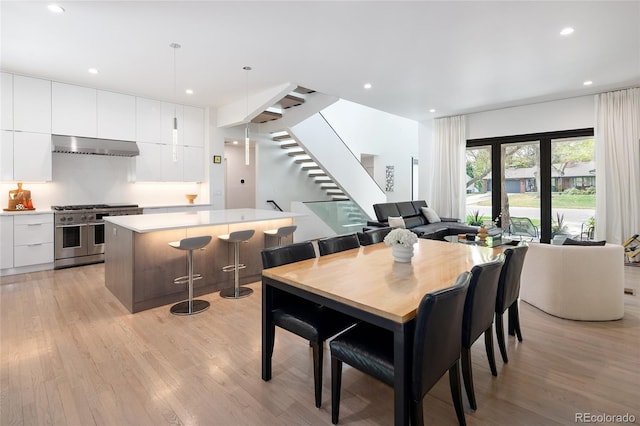 62 Jasmine St, Denver, CO 80220 - dining space featuring stairs, light wood finished floors, and recessed lighting