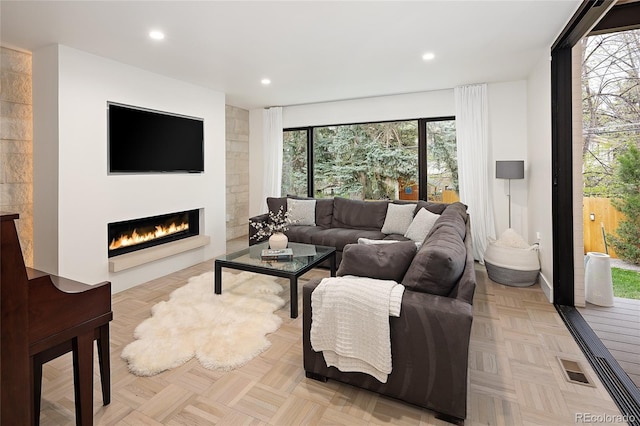 62 Jasmine St, Denver, CO 80220 - living area with a glass covered fireplace and recessed lighting