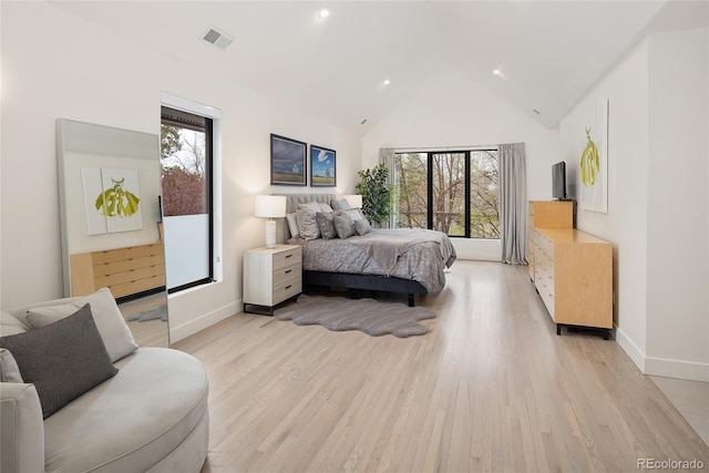 62 Jasmine St, Denver, CO 80220 - bedroom with light wood finished floors, baseboards, high vaulted ceiling, and recessed lighting