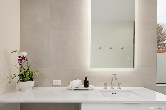 62 Jasmine St, Denver, CO 80220 - bathroom featuring vanity, tile walls, and backsplash