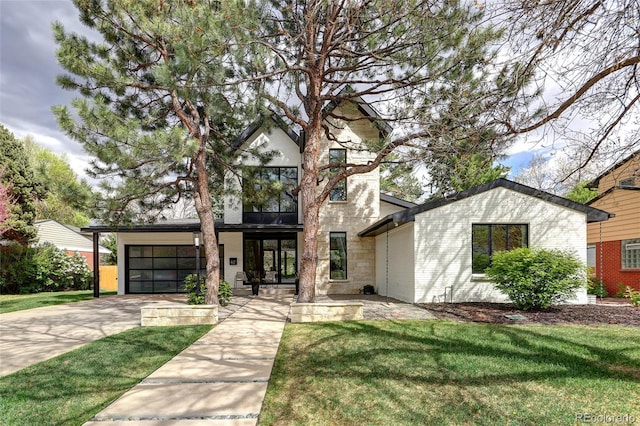 62 Jasmine St, Denver, CO 80220 - view of front of property featuring driveway, a front lawn, and stone siding